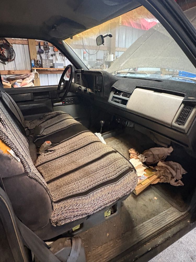 An interior shot from the passenger side of a 1988 GMC Sierra K1500 single cab long bed SLE

it has been neglected for at least the last 20 years

it’s disgusting