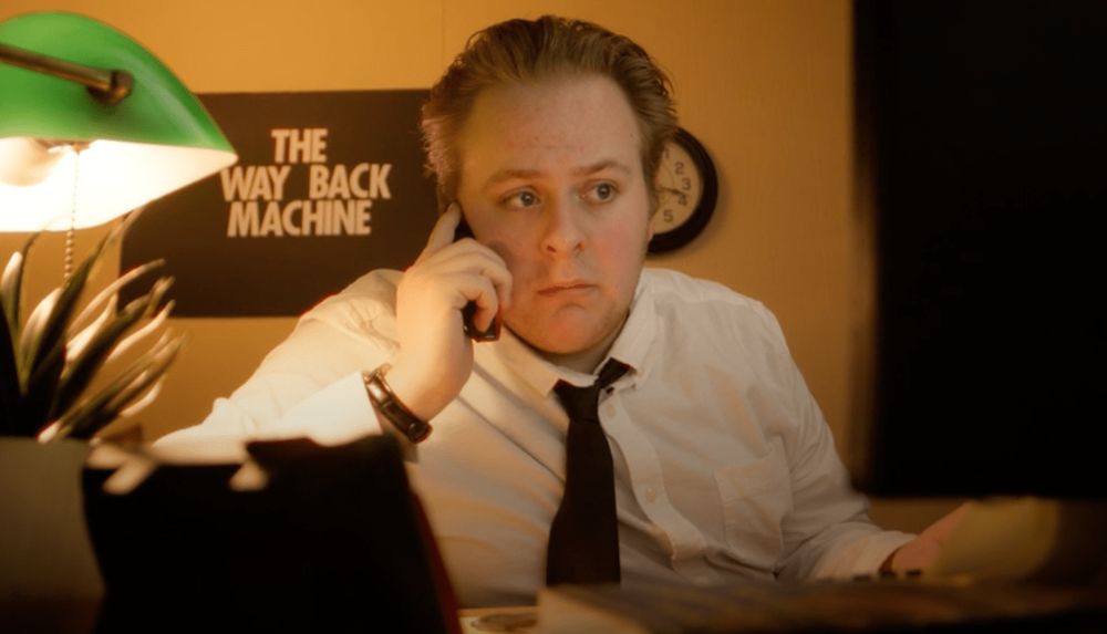 A frame of Dylan Cote from the short film 'THE WAYBACK MACHINE,' a short film by Diego Diaz and Can Sark, which earned an Honorable Mention for the 2025 Public Domain Day Remix Contest.