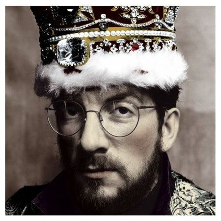 The cover photo to Elvis Costello's 1986 album, "King of America" shows him wearing a crown that's colored in in an otherwise monochrome photo of him.