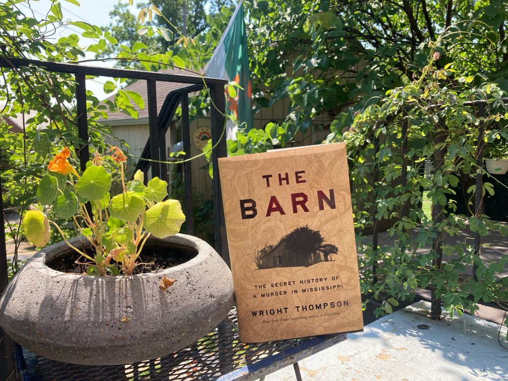 wright thompson’s the barn outside next to some nasturtiums in a concrete pot