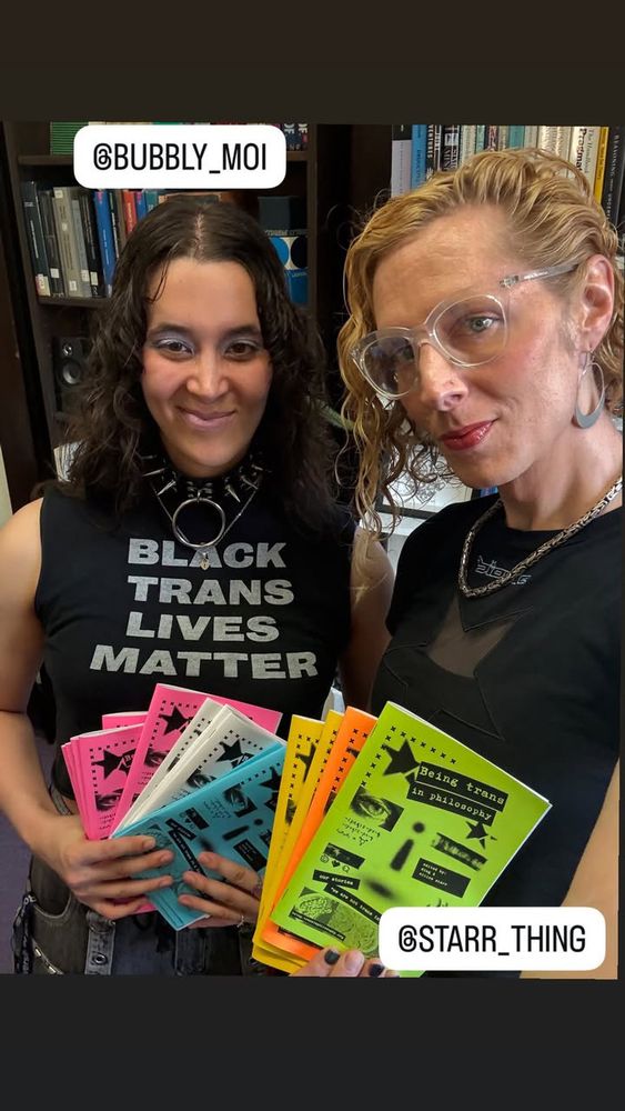 Photo of Maximiliana and co-editor Willow posing with copies of the zine. Maximiliana's shirt says “Black Trans Lives Matter.”