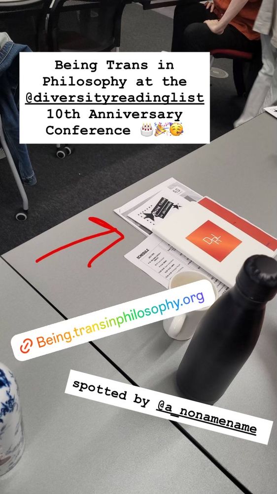 Phot of the Trans in Philosophy zine spotted on a table at the Diversity Reading List 10th Anniversary conference, under the conference program booklet.