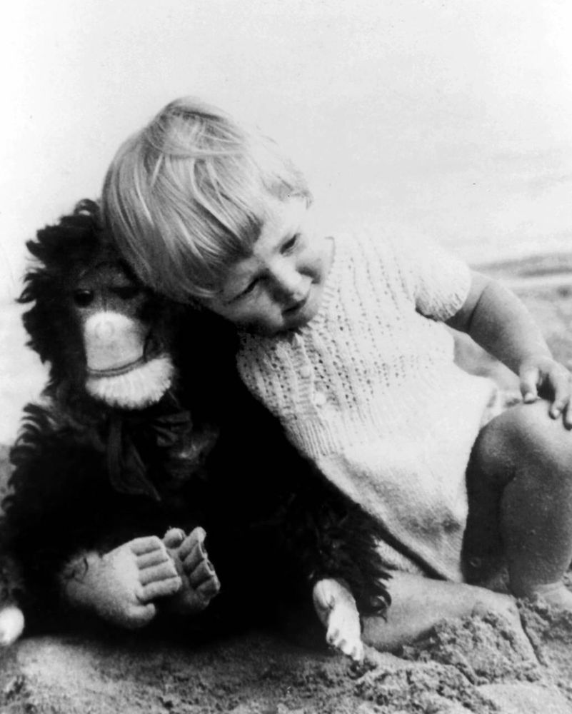 a young Jane Goodall with her stuffed chimpanzee 
