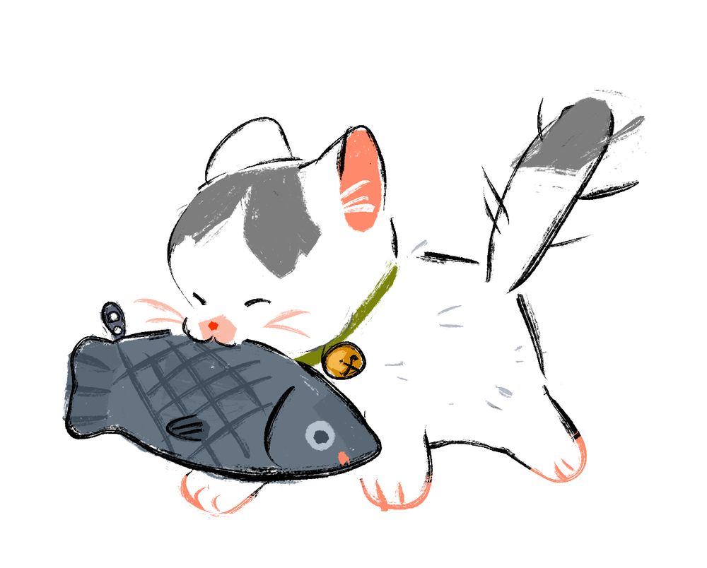 small white & gray kitten holding a toy fish in its mouth    it looks very happy 