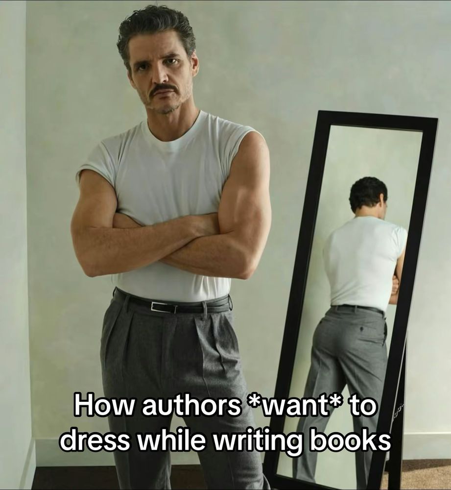 Pedro Pascal in a white shirt and grey pants