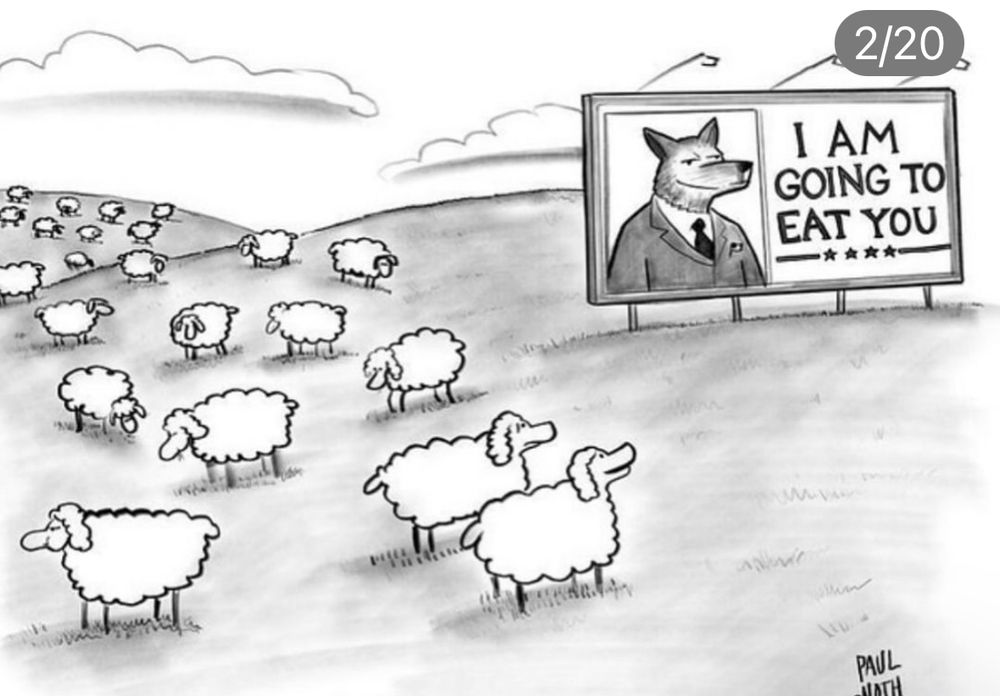 Cartoon. Sign with wolf on it saying is am going to eat you. Sheep under the sign looking at it