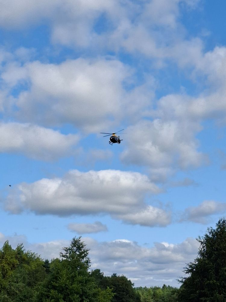 Helicopter passing over head