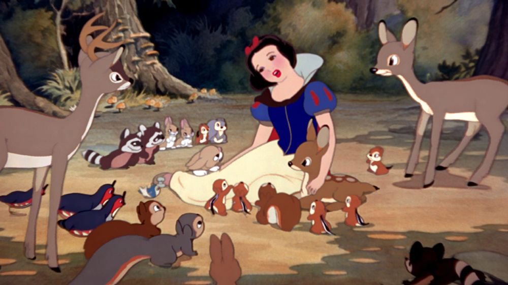 Snow White singing while surrounded by forest animals.