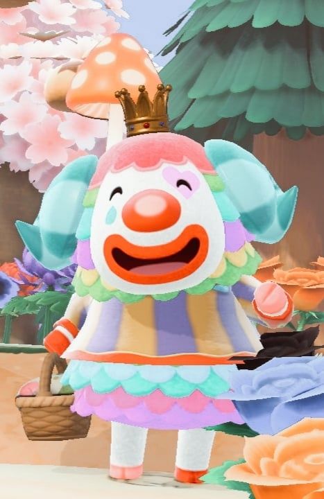 Pietro, a smug sheep that looks like a clown. He is smiling and waving in this picture. 