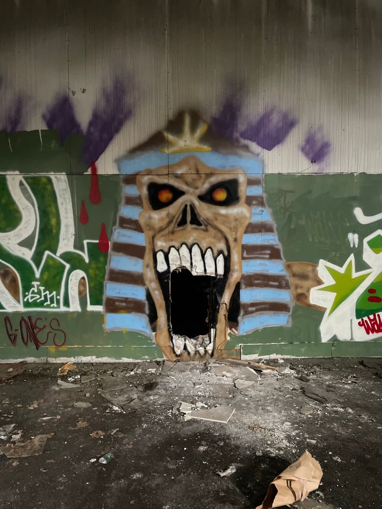 a graffiti piece of a zombie pharaoh head