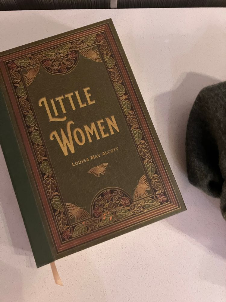 A green and gold cover of Little Women by Louisa May Alcott