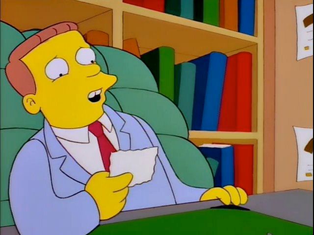 Lionel Hutz looking at a paper before taking a pen to "correct" it.