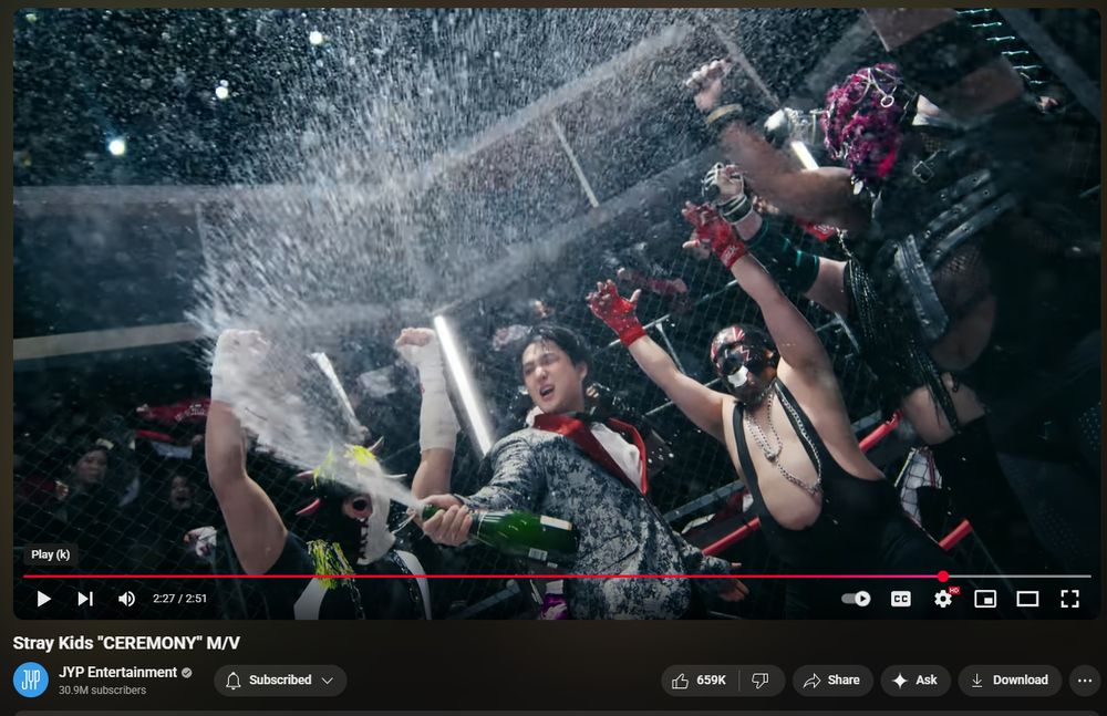 Changbin spraying champagne with the wrestlers.