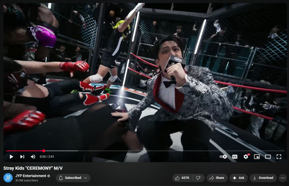 In the caged masked wrestler battle royal, he's still rapping