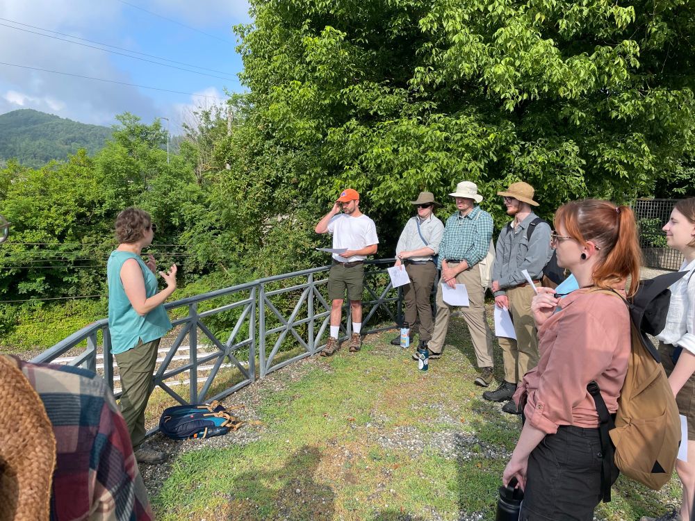 Katie reviews past excavations now part of the Libarna archaeological park for a group of students. 