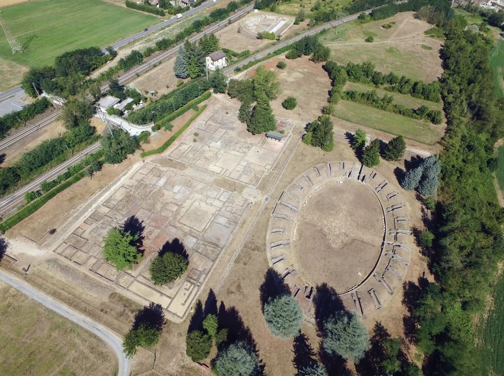 Aerial shot of the site showing the amphitheater, theatre, and two city blocks.