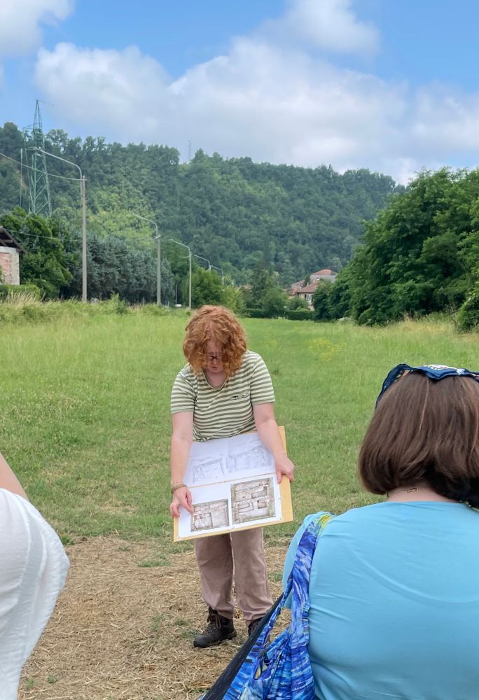 Alexis reviewing the plan of features in her trench from last year. 