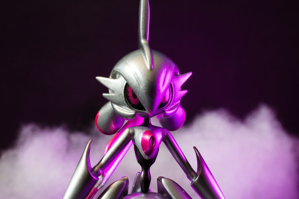A figure of a shiny Iron Valiant with a purple glow coming from the right side.