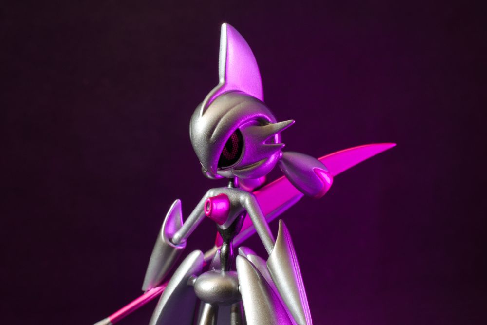 A figure of a shiny Iron Valiant with a purple glow coming from the right side.