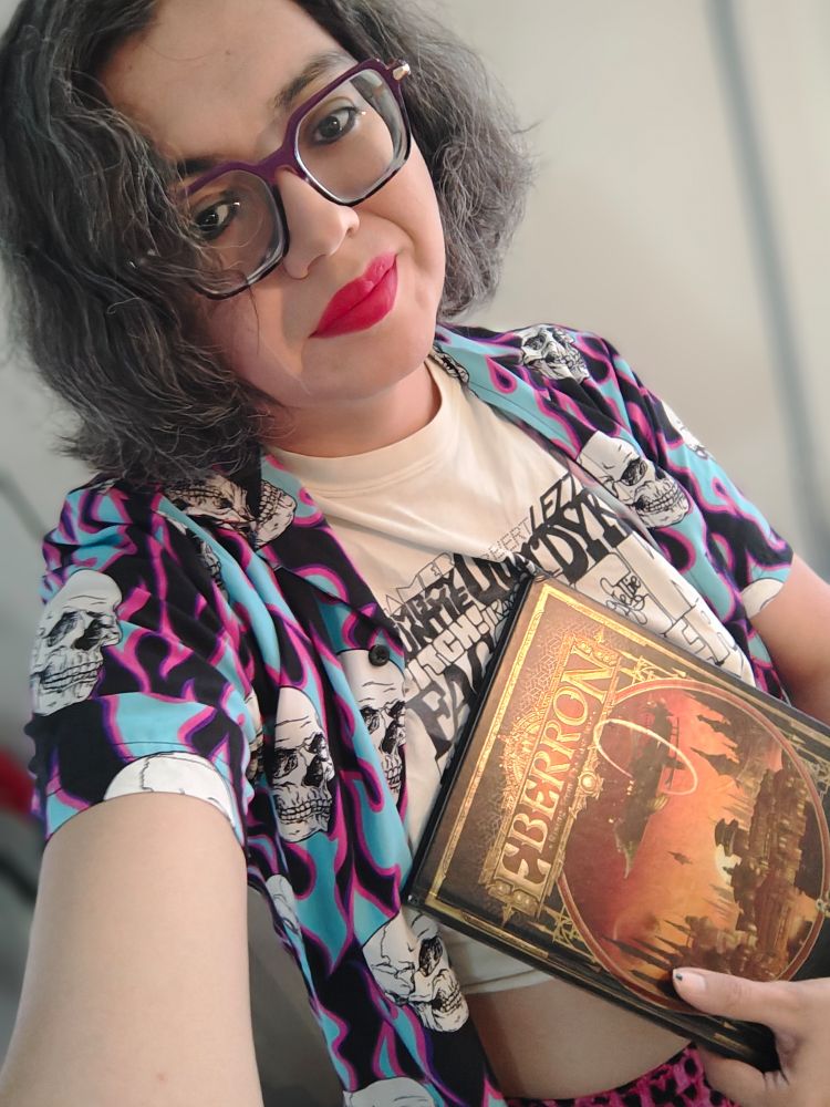 Janine looking hot holding an eberron book