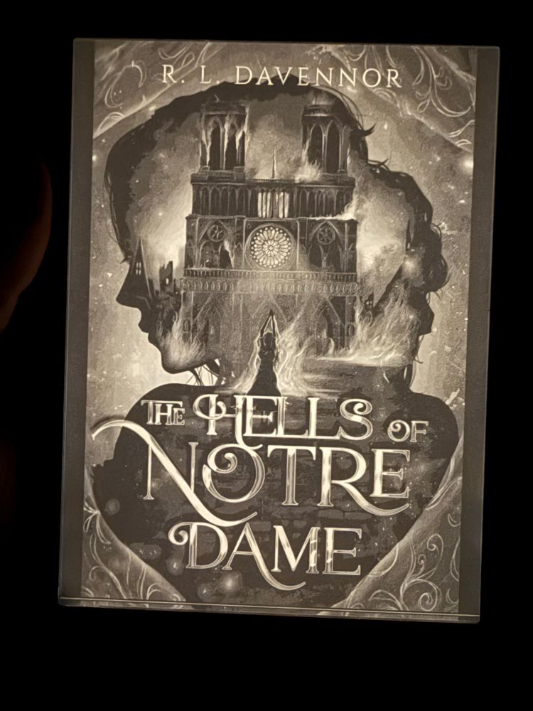Ereader screen displaying the cover of the hells of notre dame by r.l. davennor 