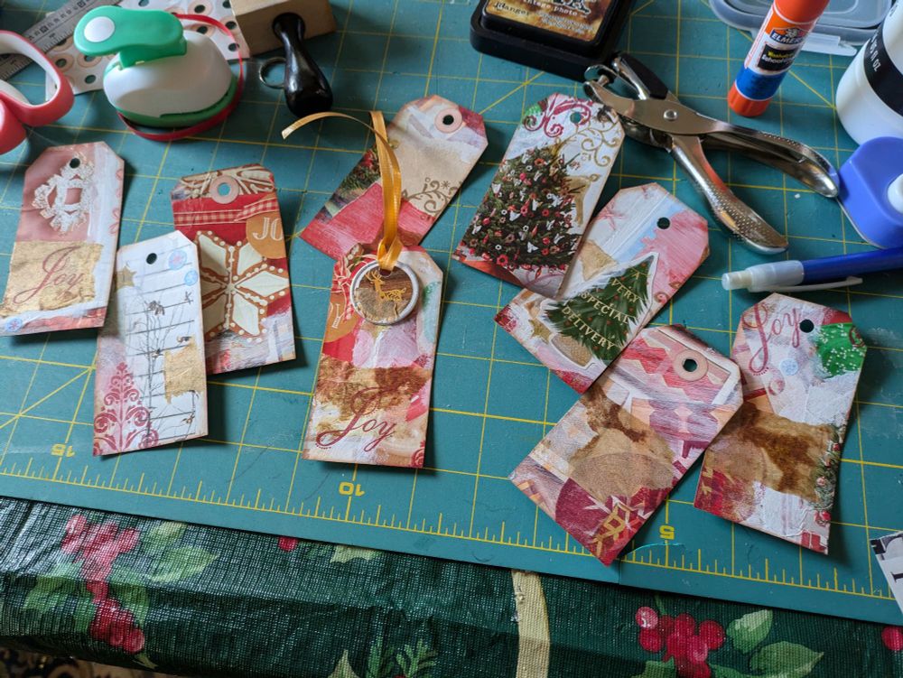9 tags cut 2" x 4" with red and brown accents 