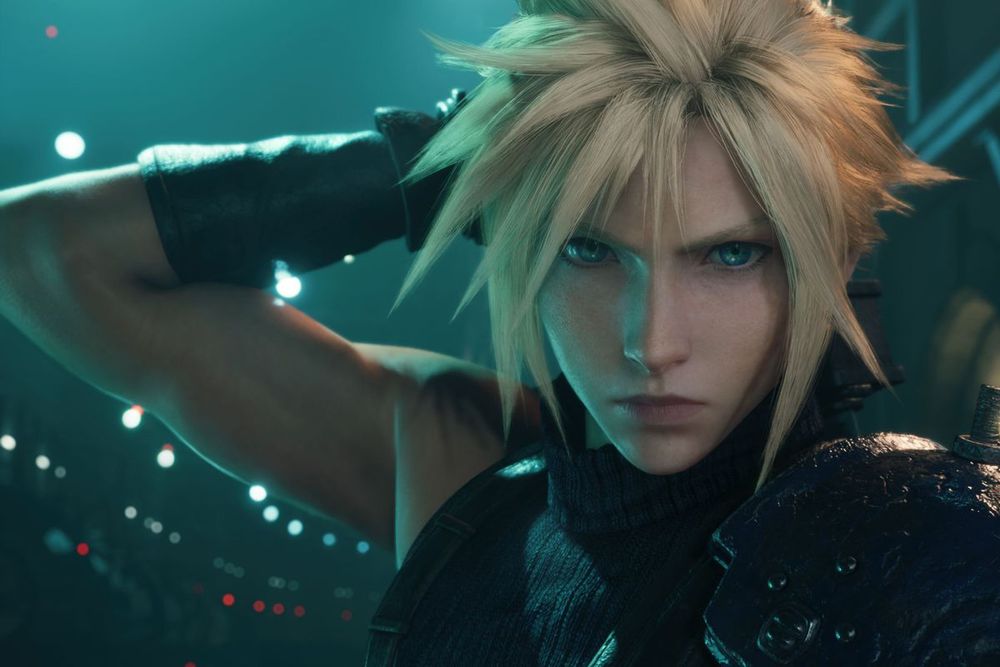 Cloud Strife, a blond man with spiky hair and blue eyes facing the camera  head on, his arm cocked upward to hold his sword behind him. 