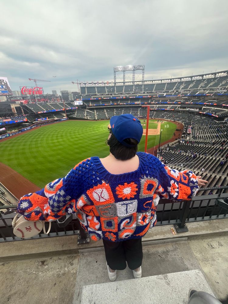 the back of the cardigan, it spells METS