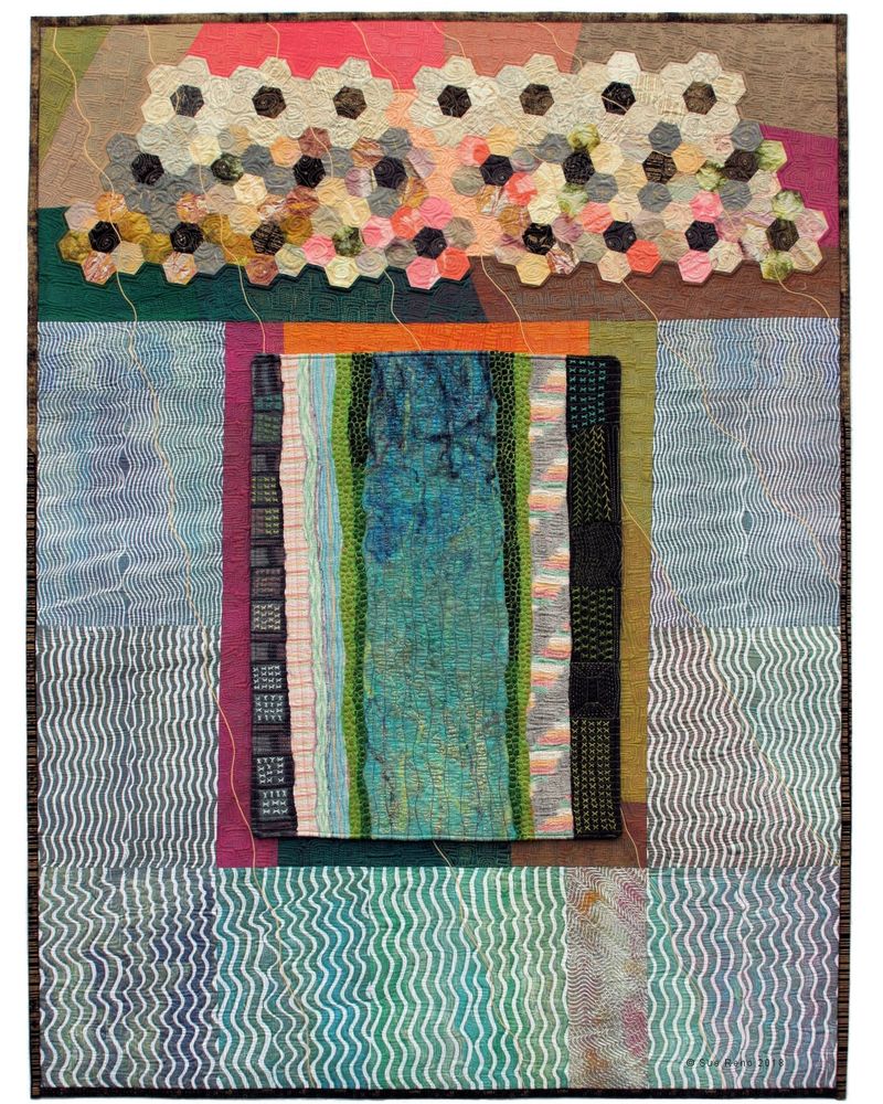 Art quilt with an embroidered panel, monoprinted background, and stitched hexagons, in a wide variety of colors.