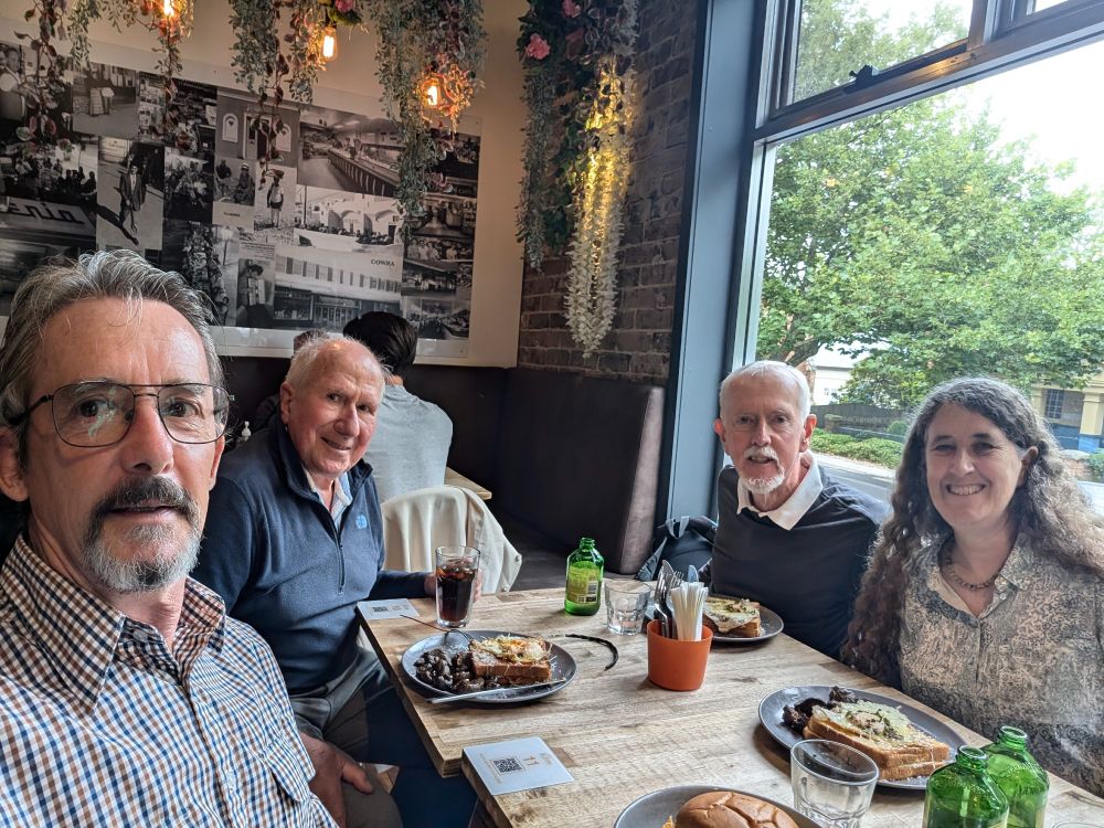 Four people have lunch at a cafe: (L to R) Craig Barton, Joe Landsberg, Ross McMurtrie, Belinda Medlyn