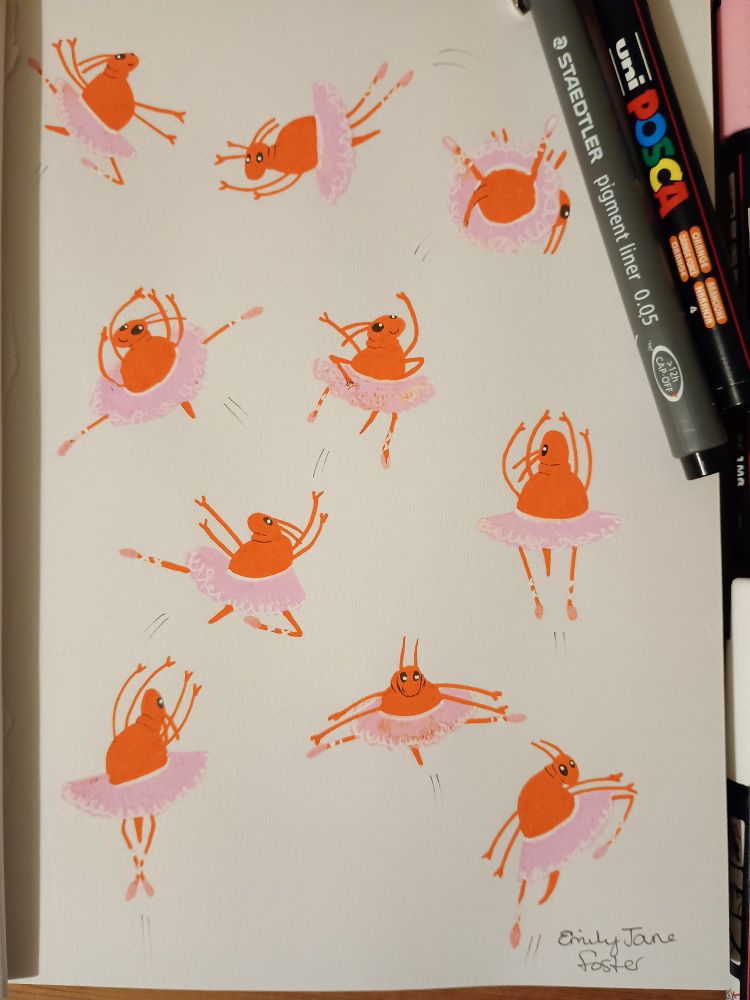 A photograph of a Staedtler 0.05 pigment liner and Posca pens around a sketchbook with colour cartoon illustrations of 10 leaping springtails. The springtails are stylized, bright orange with tiny cute black eyes. They are wearing pink and white tutu's and ballet shoes and are positioned in different leaping ballet poses!