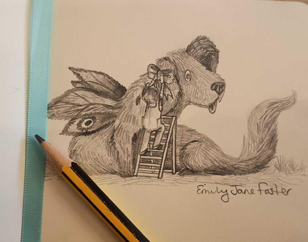 A photograph of a pencil and blue ribbon resting on a sketchbook page with a pencil illustration of a girl and an elongated, furry dog-like creature with moth-like wings. The creature sits patiently while the girl climbs a step ladder to pin a giant bow in its ear. Art by Emily Jane Foster.
