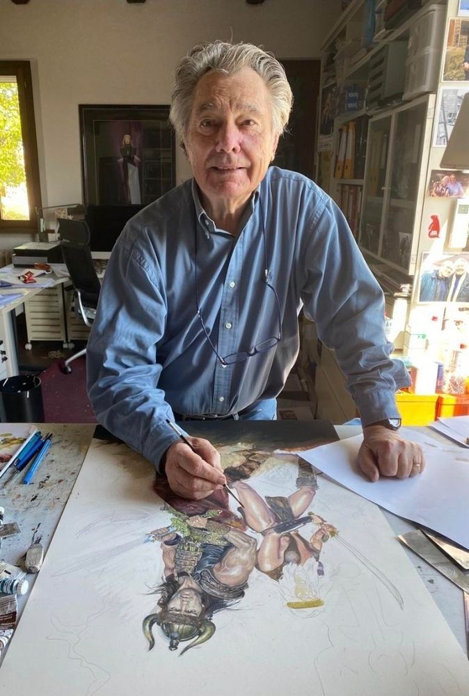 Renato Casaro painting a variation of the famous Conan The Barbarian poster