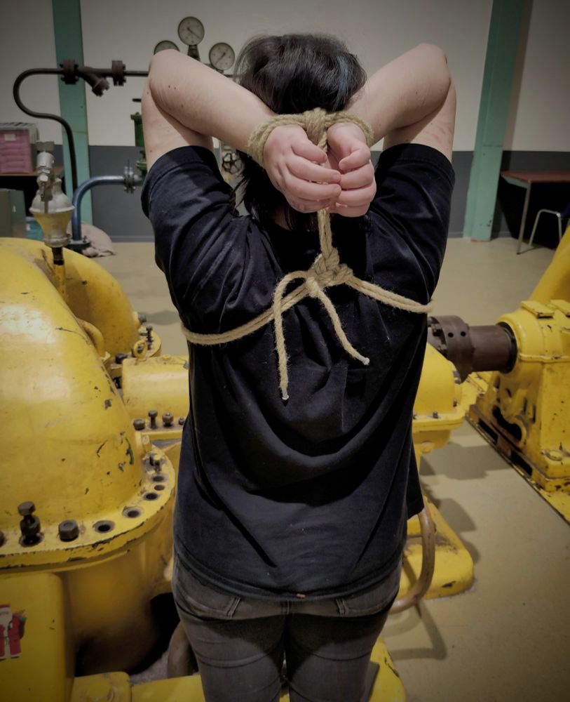 Over the head double column tie with an industrial background 