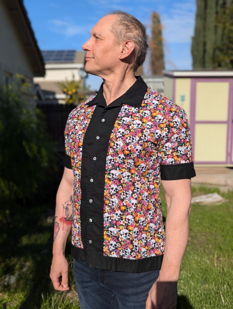 Walter wearing the handmade shirt, facing left. 