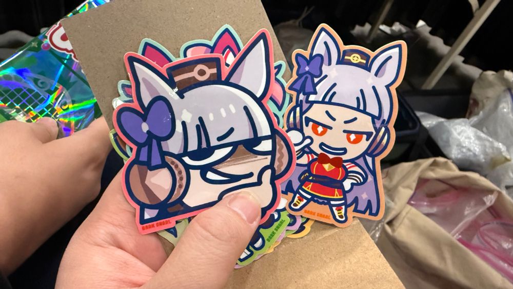 Two smug gold ship stickers 