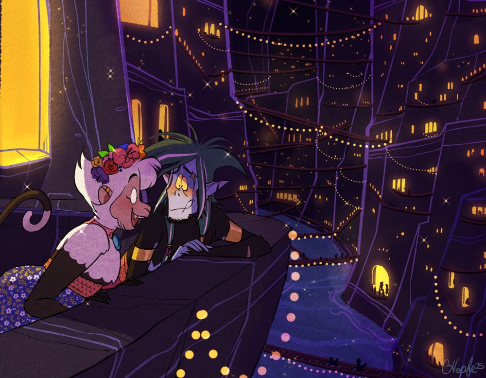 Cartoon illustration of Kila and Zabolo overlooking an underground city. The city is hundreds of glowing lights carved into the walls of a cavern, with ropes of lights and bridges connecting everything. At the bottom is a river that flows through the caves. Kila looks out from the stone balcony in awe of the city, while Zabolo looks longingly at Kila
