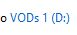 The name of a storage drive. "VODs 1" and in brackets, D followed by a colon, appearing similar to an unhappy face.