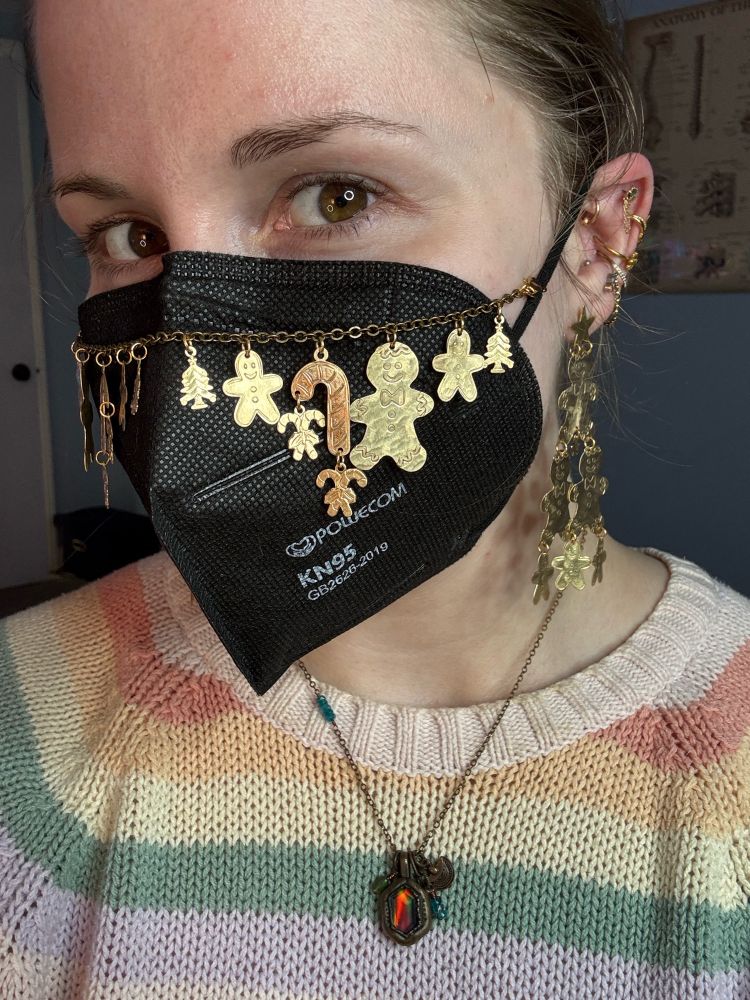 Me again, now wearing the Cookie Sheet mask chain, featuring large & small gingerbread people, candy canes, and little Christmas trees. Also seen are gingerbread Christmas tree earrings 
