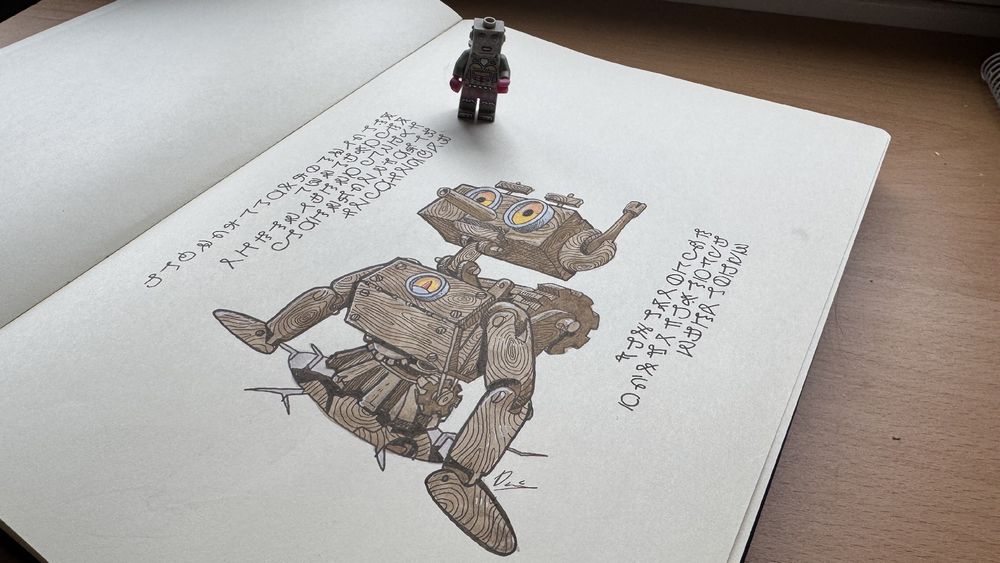 A page of a sketchbook. A wooden robot emerges from a hole in the floor. Only the eye rims and a dial are of metal. And both have yellow light from them. Handwritten notes on both sides of the drawing in a secret calligraphy. Over the page is a Lego robot lady minifigure watching the illustration. 