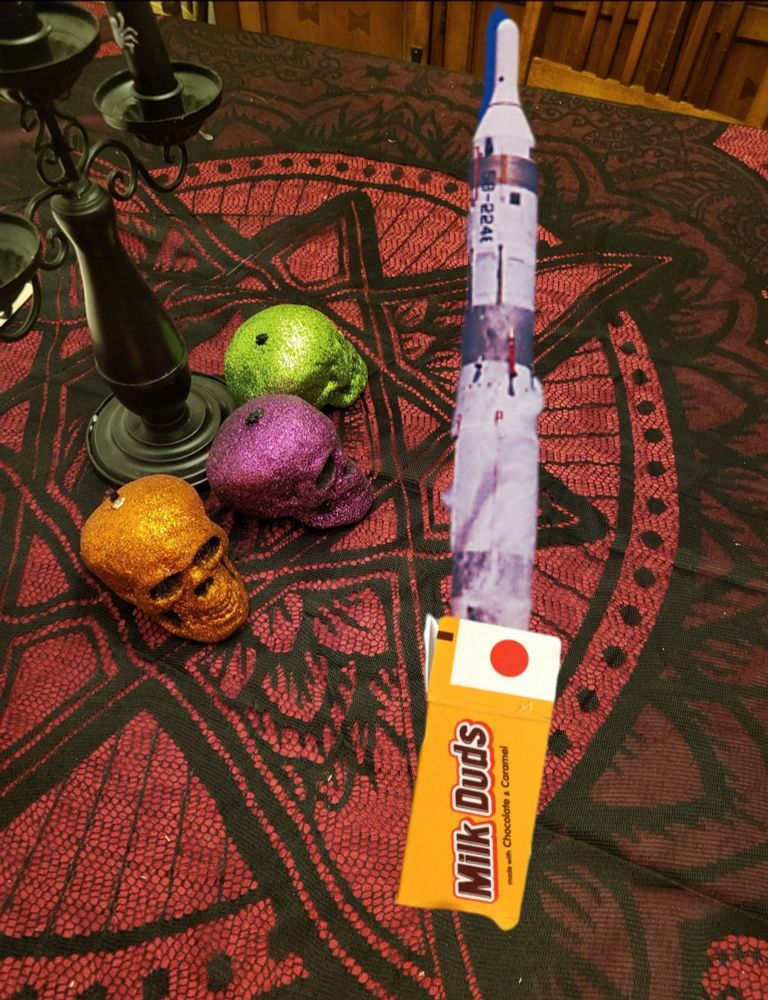 A Milk Dud box tainted with a Titan I ICBM.