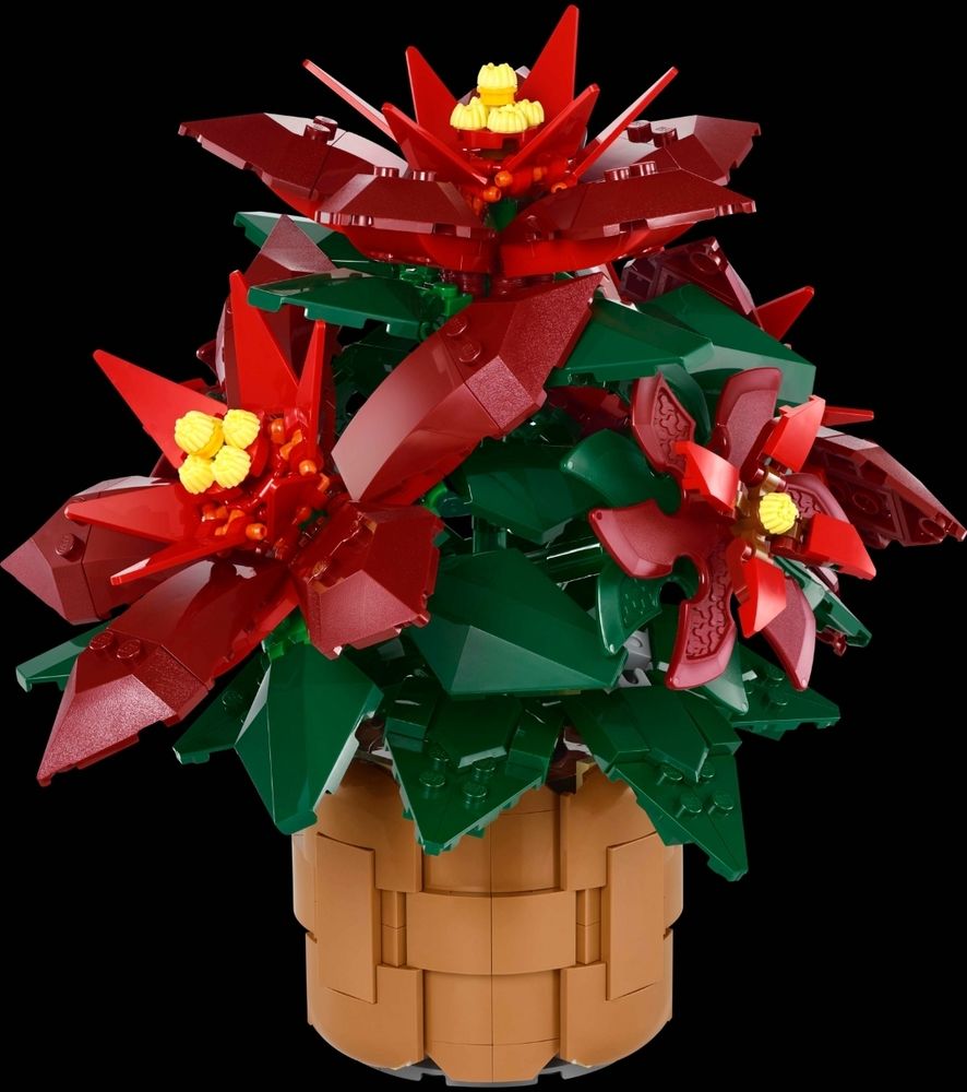 Lego-Weihnachtsstern, mit roten Blüten und dunkelgrünen Blättern, im dazugehörigen hellbraunen Übertopf