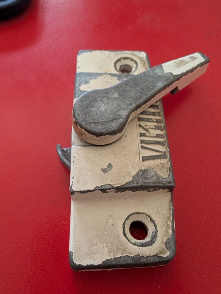 Old latch with lever at 2 pm. 