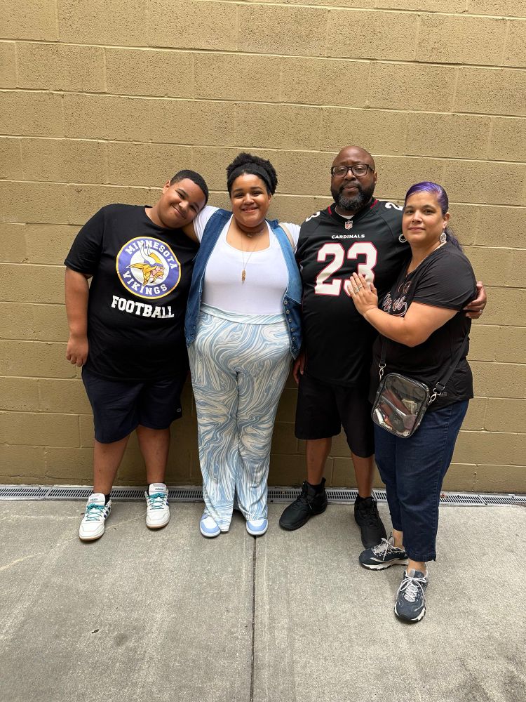 Xavier, Jasmine, Victor ( Jasmine’s dad) and Wendy ( Jasmine’s mom) smiling proudly together. Xavier is 14, Jazzie is 23. 