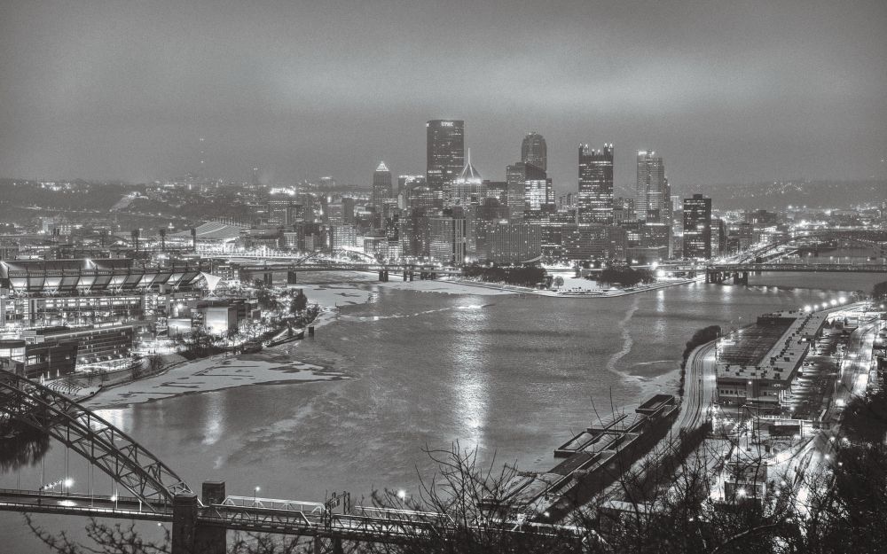 Black and white photograph of the city of Pittsburgh from the West End overlook