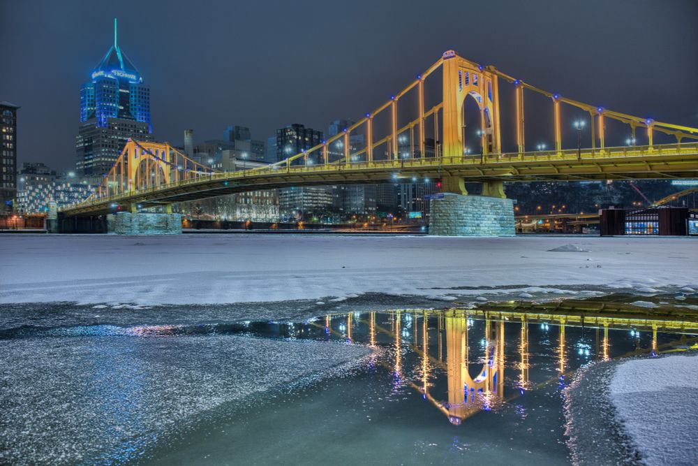 The Roberto clenente bridge in downtown Pittsburgh over the frozen Allegheny River. 