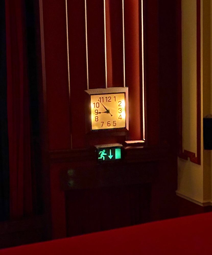 The art-deco clock at the Hyde Park Picture House says it’s about five to nine. 