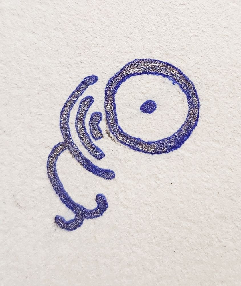 Fairy alphabet of circles, curves, and dots reading, "ewk"