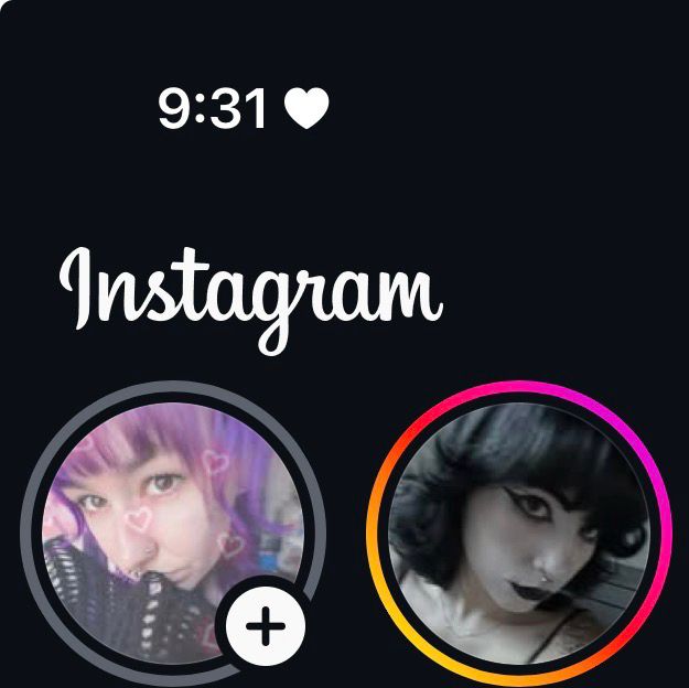screenshot of instagram, two icons are showing. on the left is an icon of a girl (me) with purple hair and a heart filter wearing a black sweater, the profile on the right is a girl with black hair and black makeup, with a grey filter