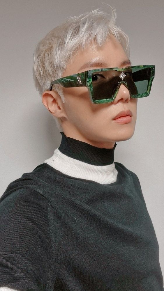 platinum hobi 2/4 face with green LV sunglasses ad wearing a turtle neck 